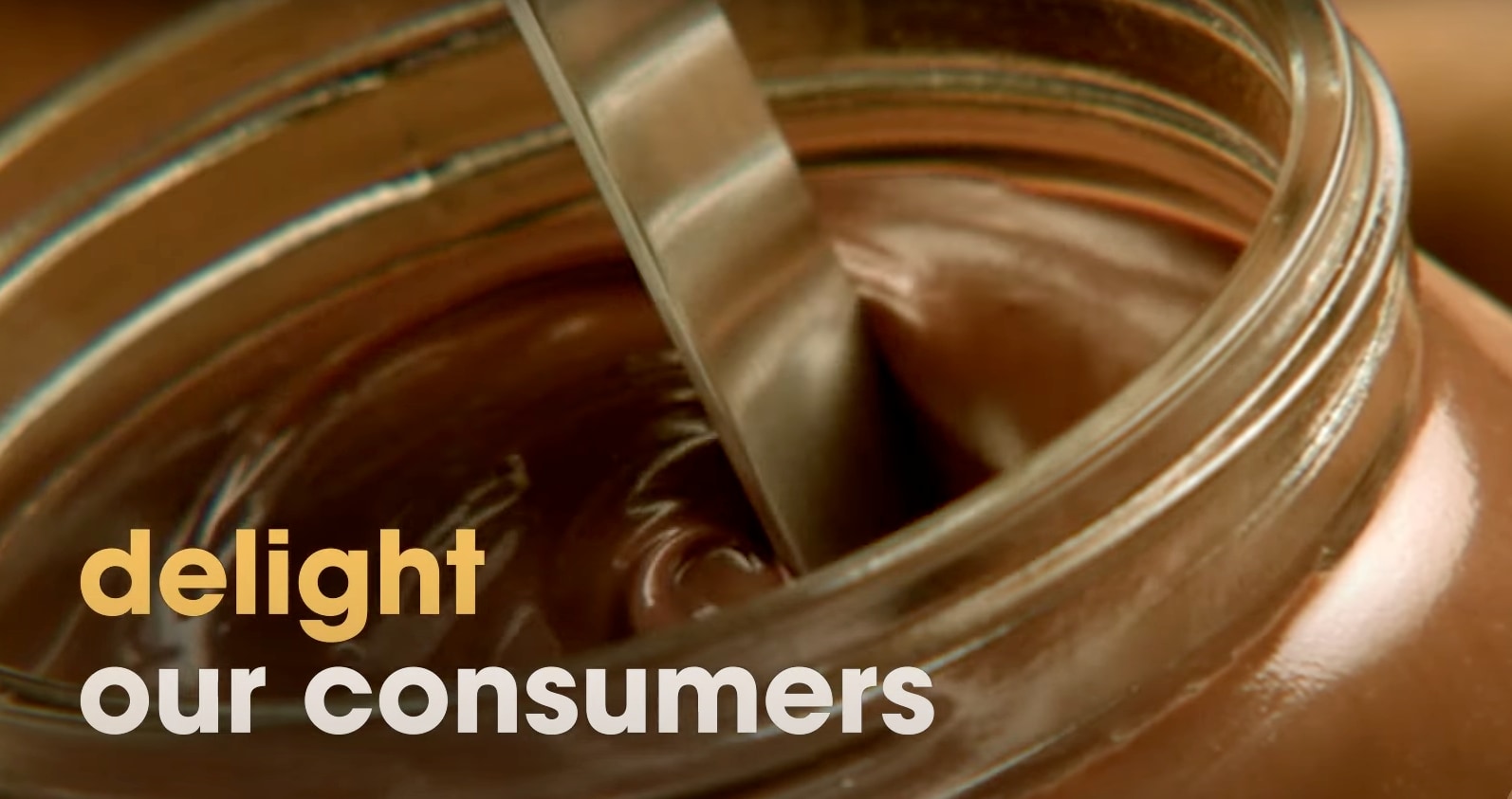 A knife stirring Nutella